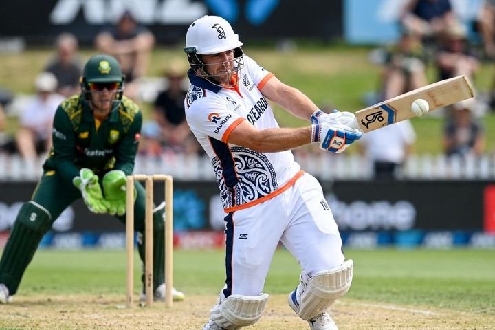 Cricket players in custom team uniforms